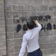 Фото пресс-службы ГУВД Бишкека. В Бишкеке милиционеры закрасили больше 400 граффити наркомагазинов
