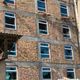Фото читательницы 24.kg. Окна в строящемся общежитии Международного университета Кыргызстана разбили